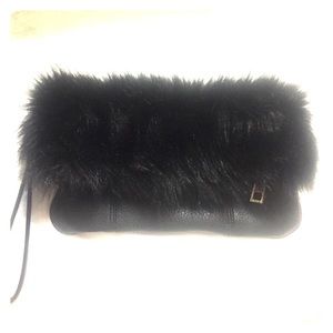 Carlos Santana brand furry clutch