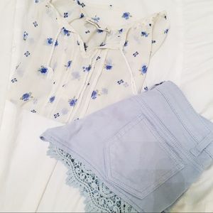 COMBO: blue lacey shorts with a floral blouse.