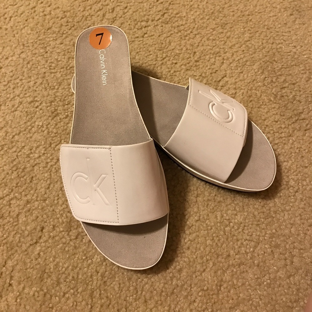 Calvin Klein white slide sandals