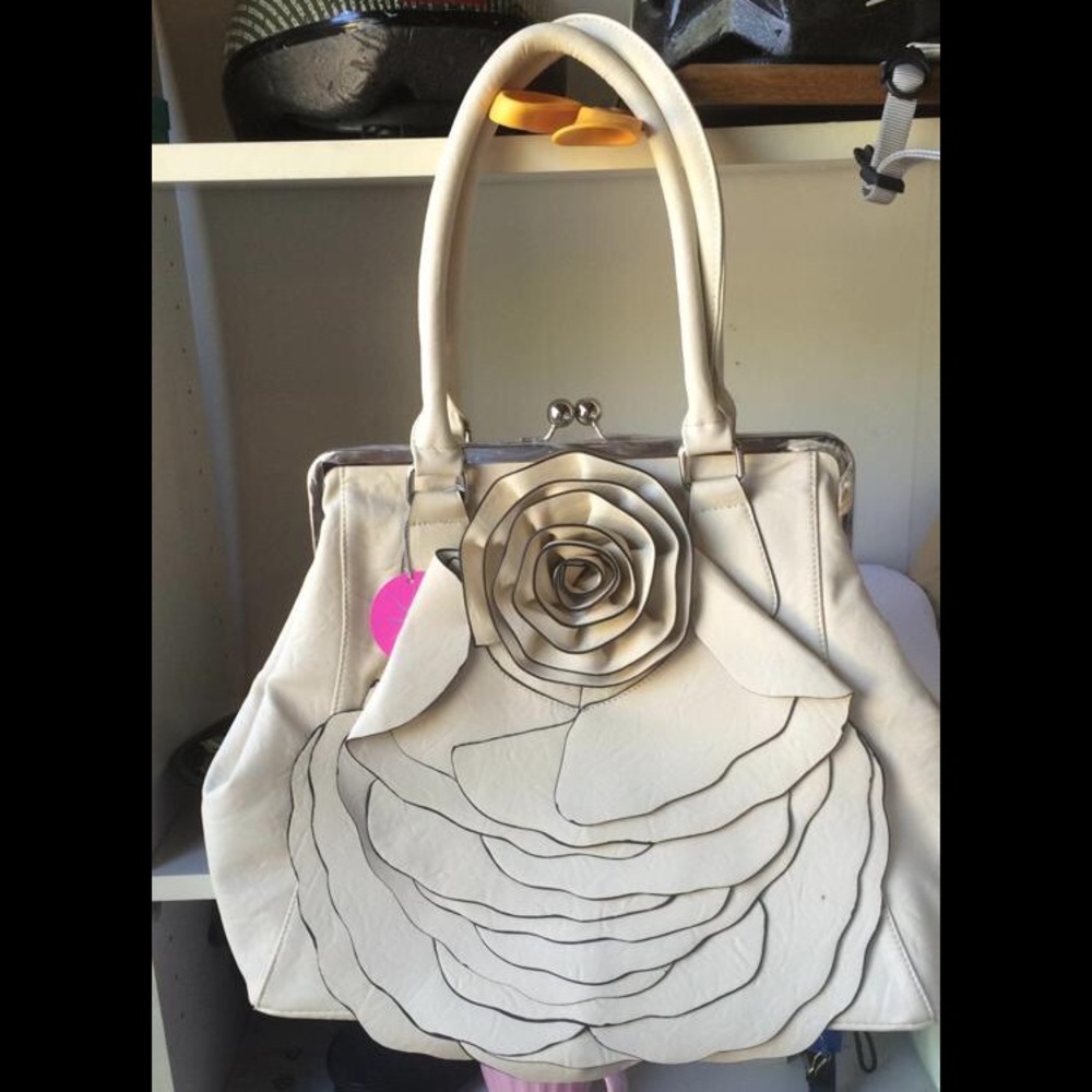 Never used tags still on ivory handbag