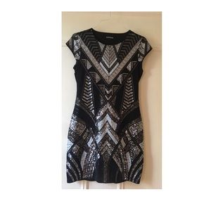 Black sequins dress .