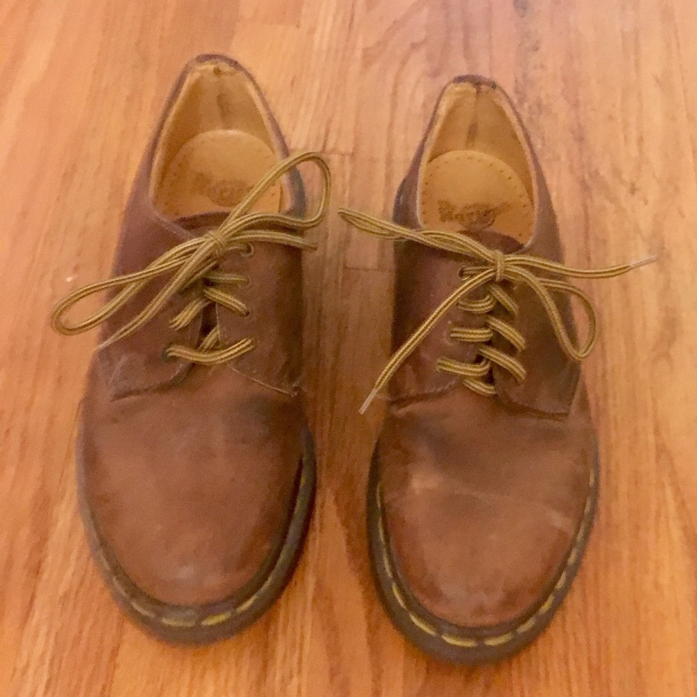 Dr. Martens brown loafers.