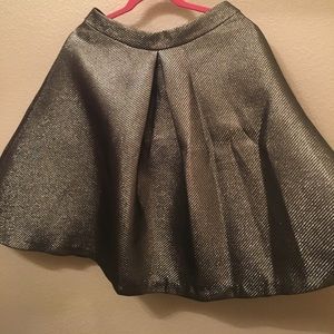 High waisted, metallic flare skirt.