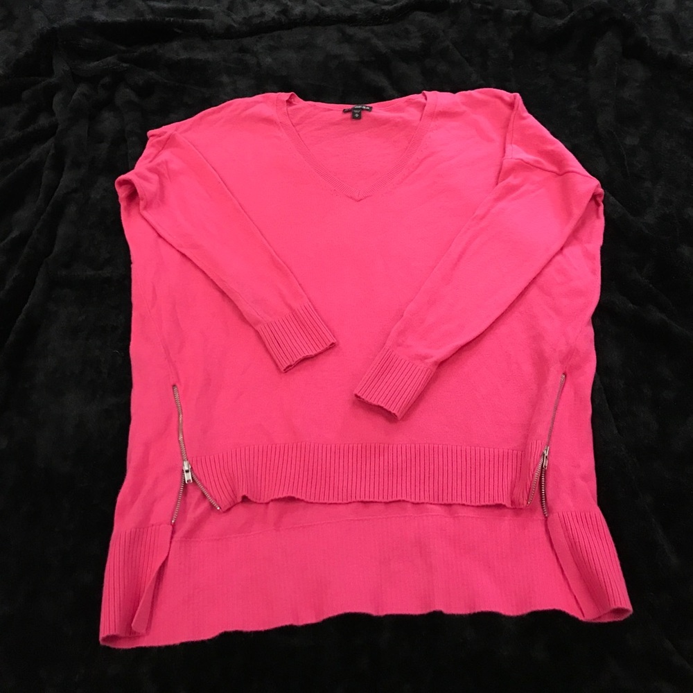 Bright pink sweater, says XS fits more like a S/M