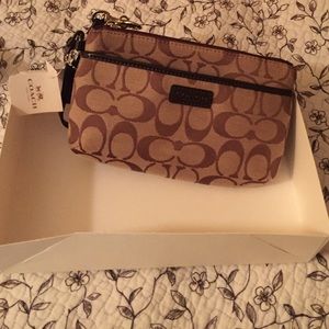 Authentic, never used coach wristlet.