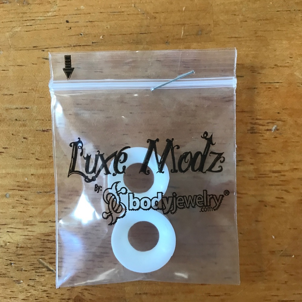 7/16th white ear skin plugs