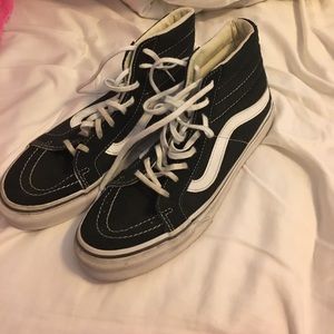 Black and white high top vans