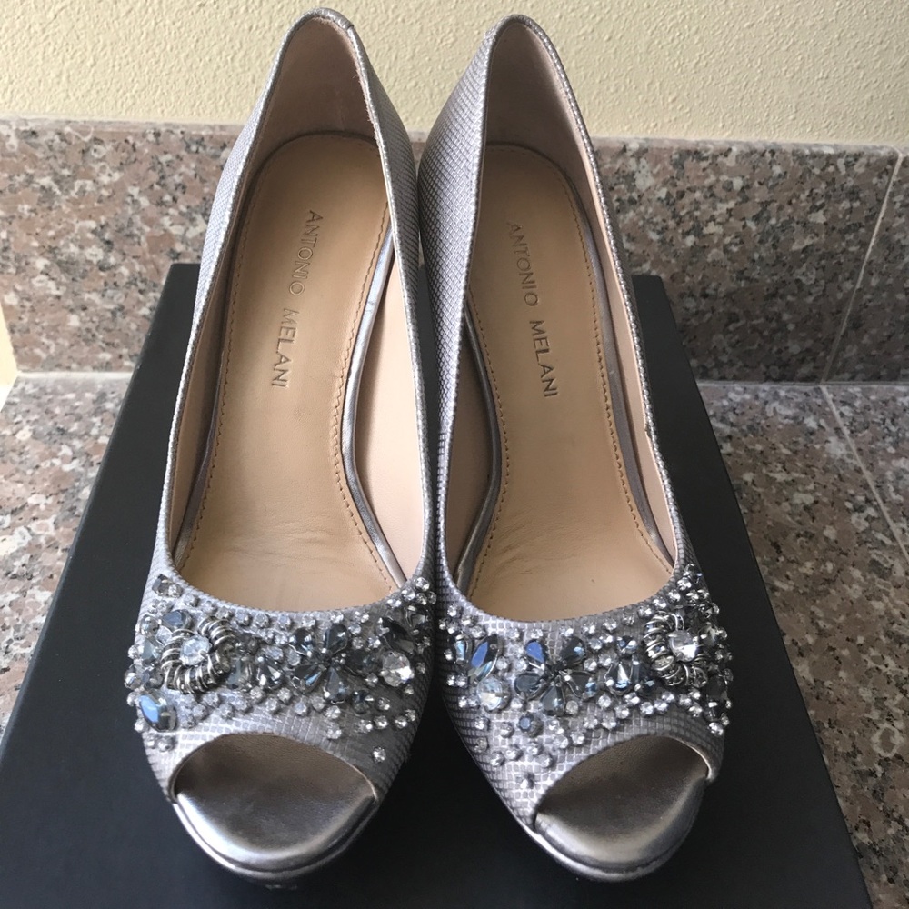 Silver heels, jewels on tips of shoes