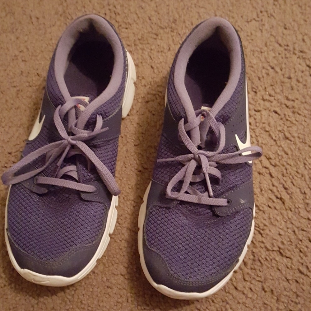 Purple Nike running shoes