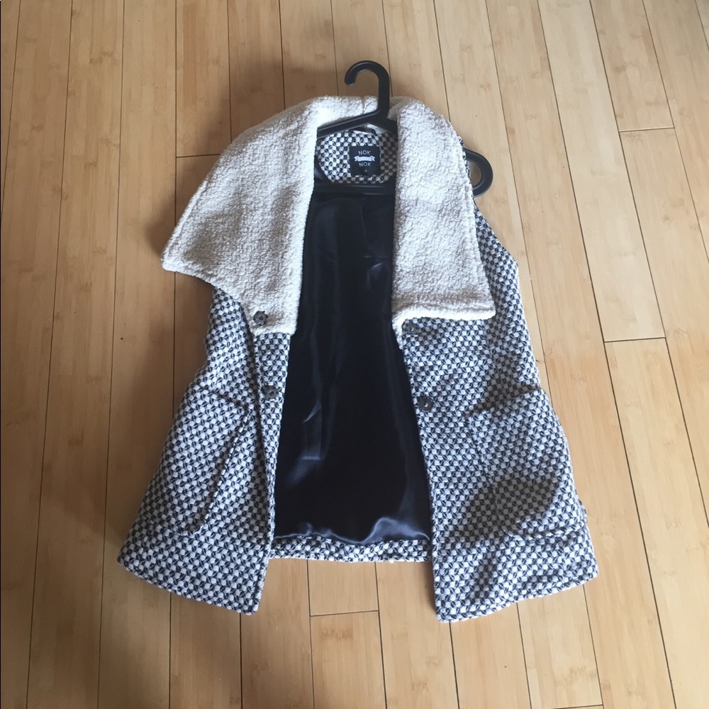 Black and white Nok Nok vest