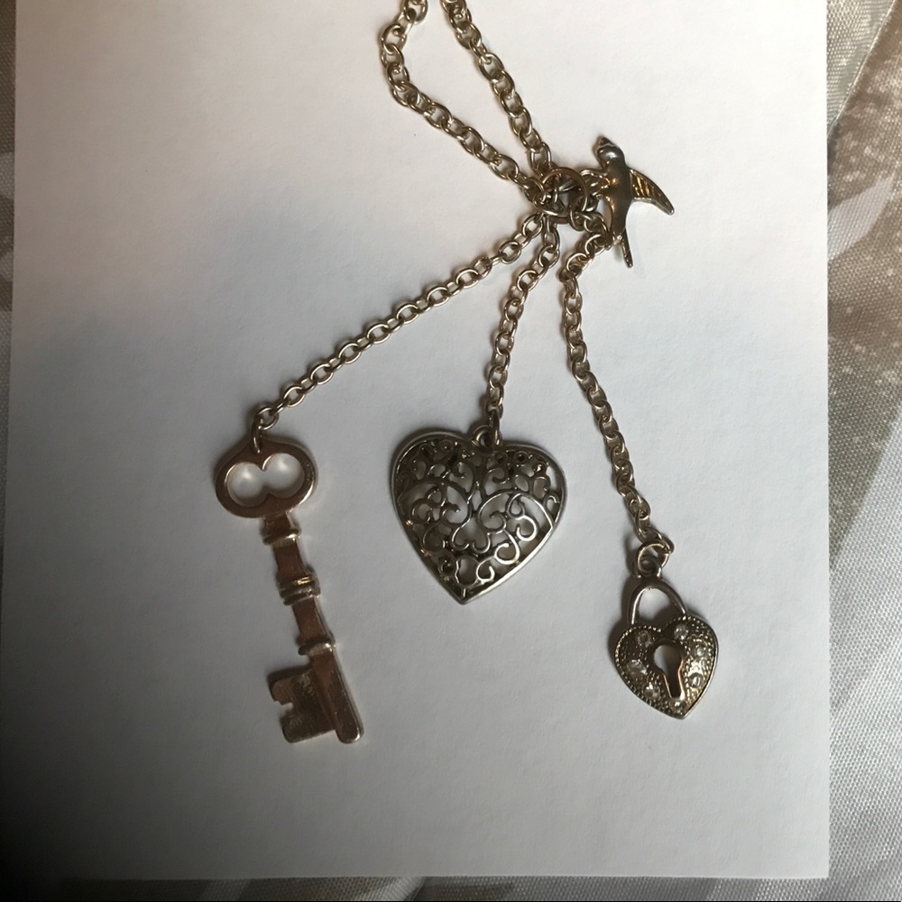 Long gold necklace with charms. Great condition