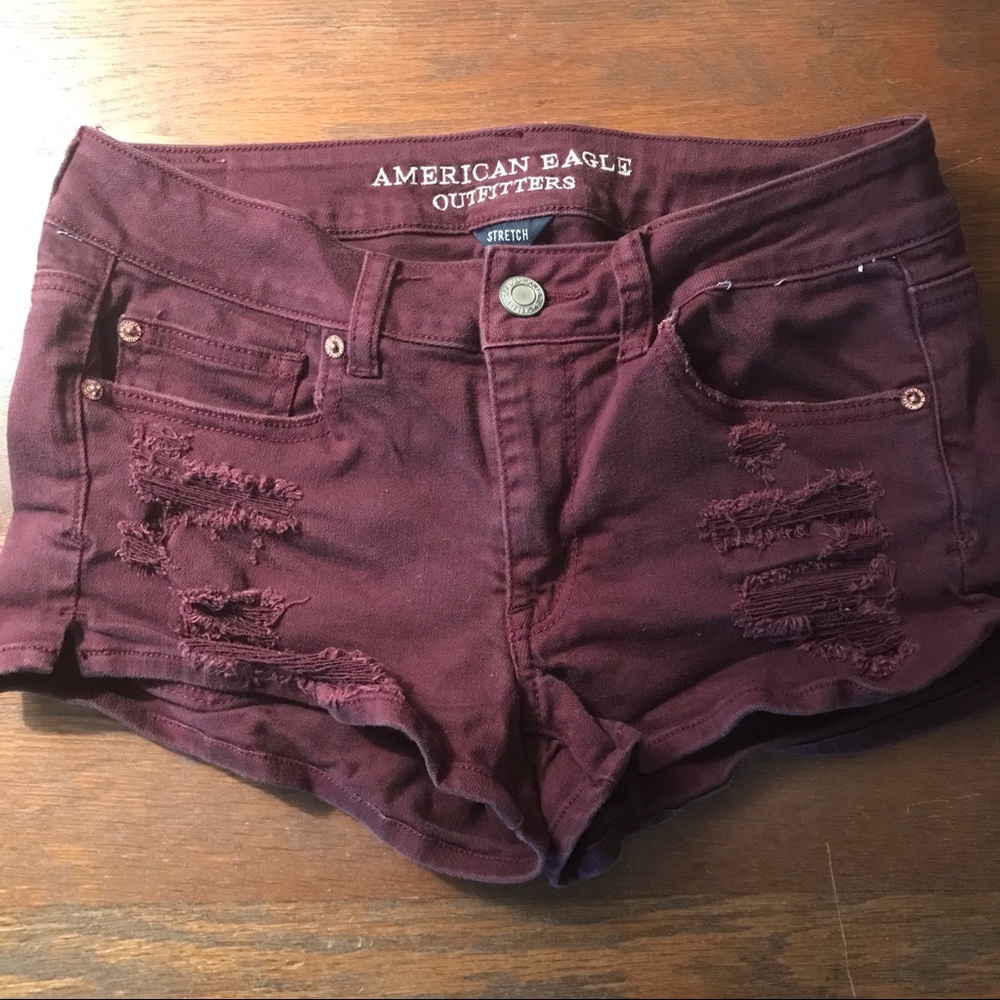 Burgundy distressed AE jean shorts