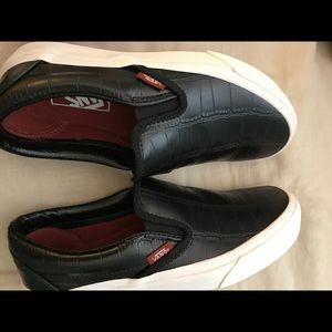Women's size 7 black leather slip on vans