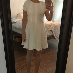 White brocade and leather knee length dress