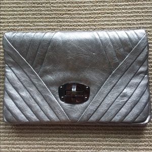 Metallic silver clutch