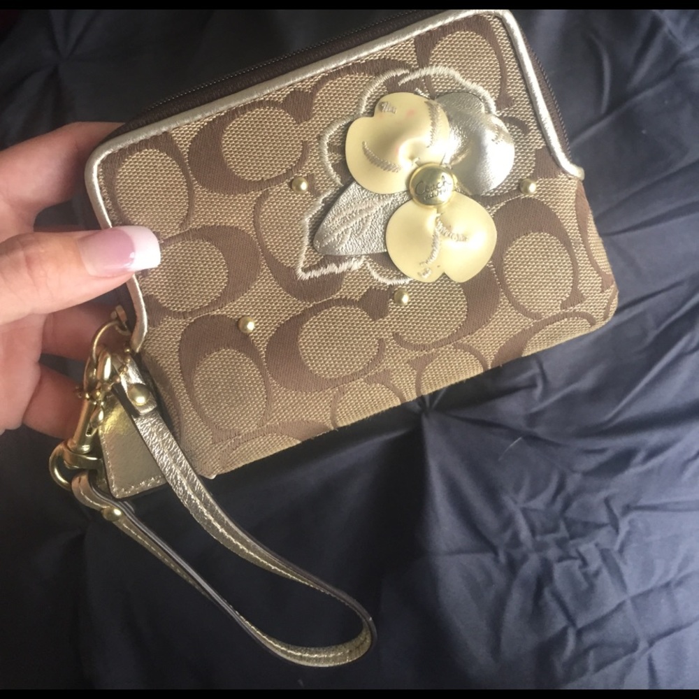 Authentic coach wristlet with flower brown