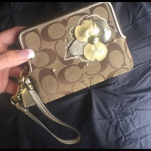 Authentic coach wristlet with flower brown