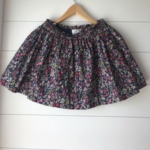 Floral skirt with a navy blue background.