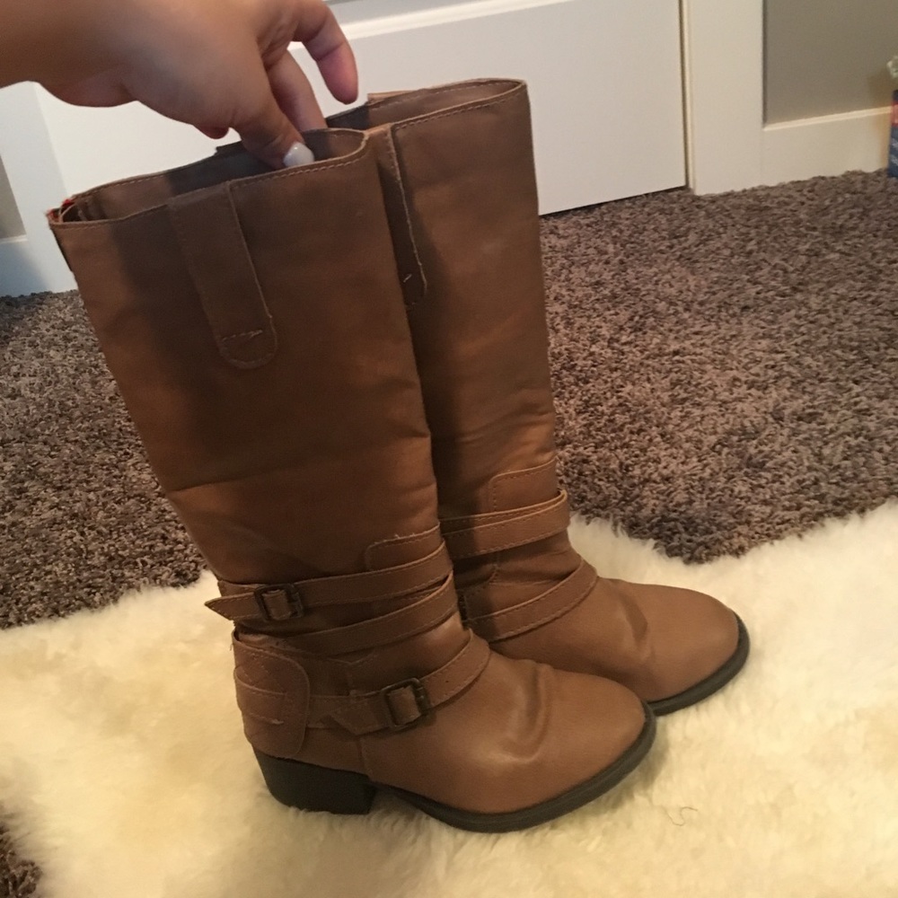 Little girl riding boots