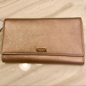 Kate Spade Newbury Lane Travel Wallet in Rose Gold