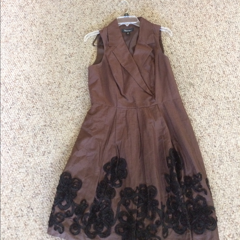 Nice ladies dress brown with flower trim at bottom