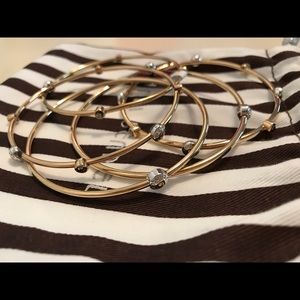 Henri Bendel gold bangles