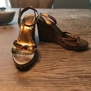 Coach 7.5 gold and brown signature wedges.