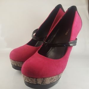 Fuchsia, snake, and black colored platform pumps