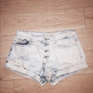 Light washed denim shorts w hints of blue.