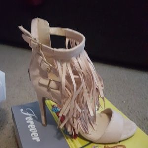 Beige colored sandle/heel.