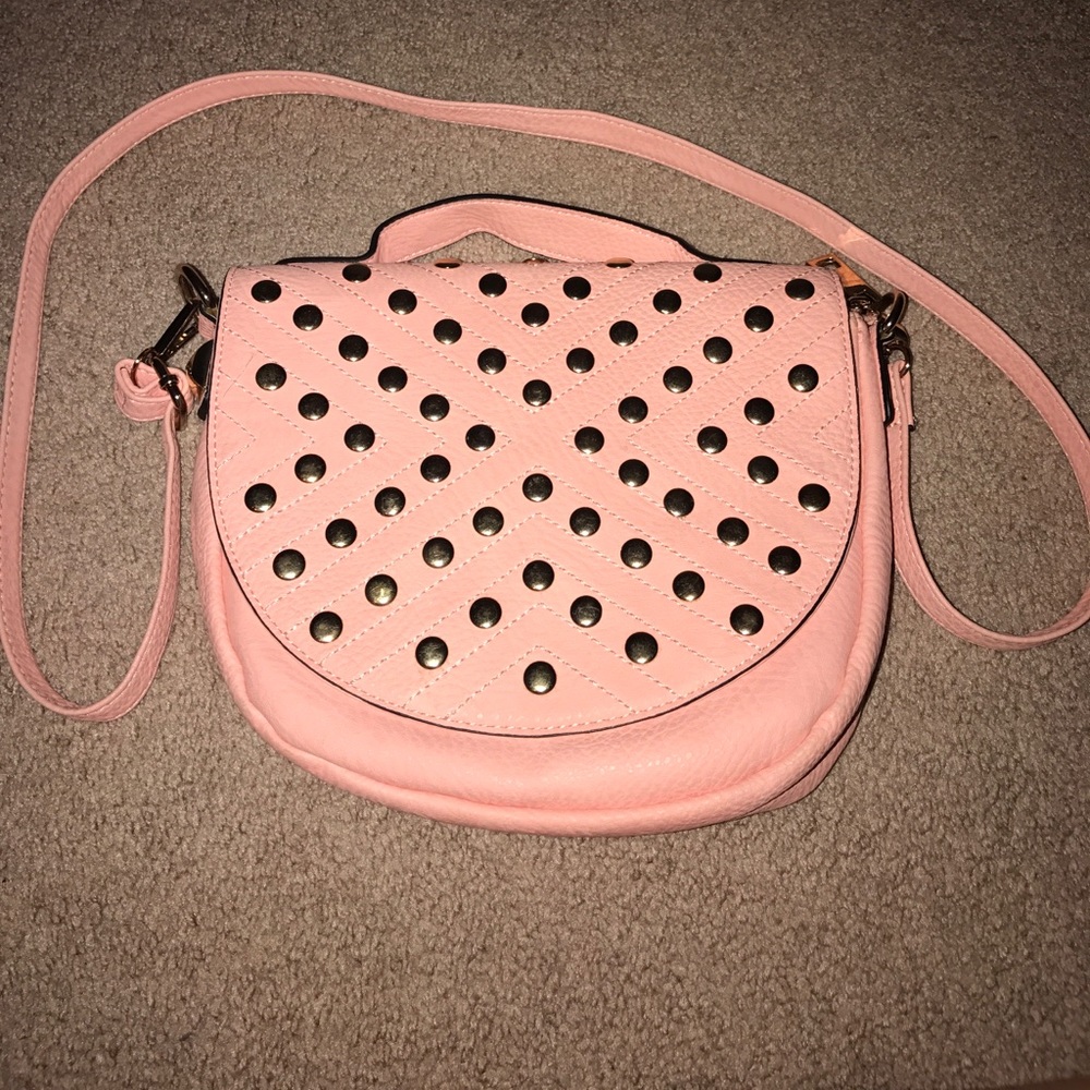 Light salmon colored gold studded crossbody bag