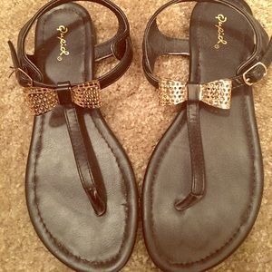 Black and gold bow sandles