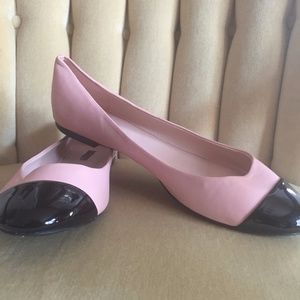 pink and black spectator flats