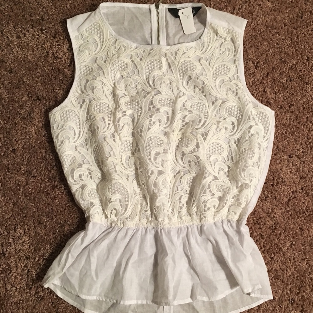 Small white lace cotton and polyester top.