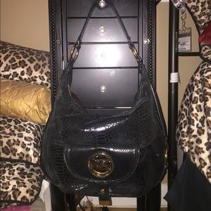 Black and gold Michael Kors bag