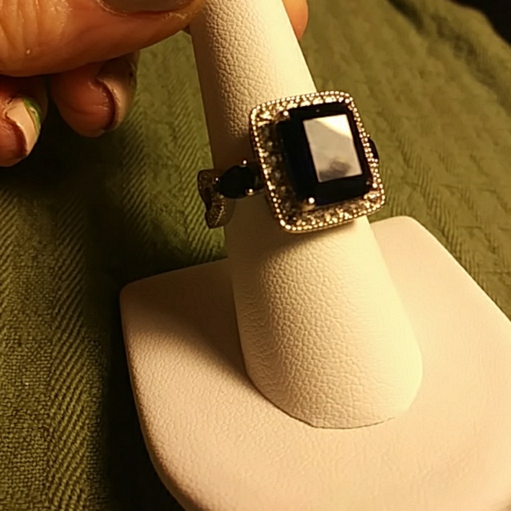SOLD  Blue sapphire ring surrounded by White sapphires