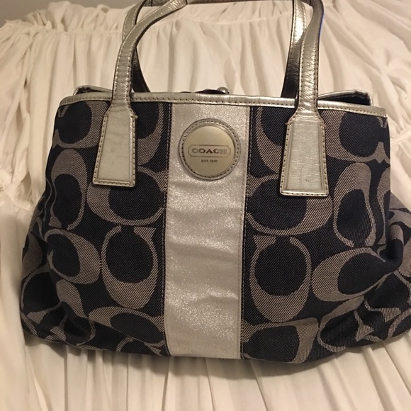 Coach Handbags - dark blue  with silver handbag .