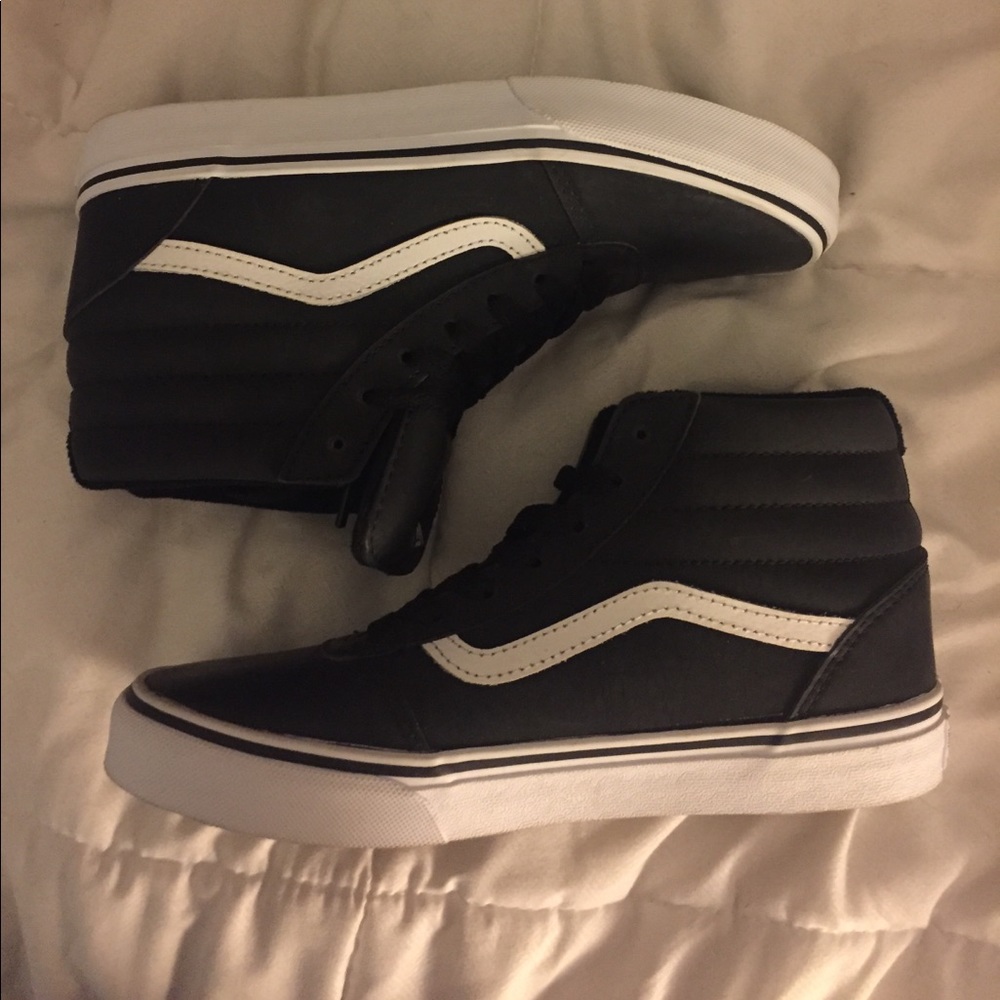 Black and white high top vans