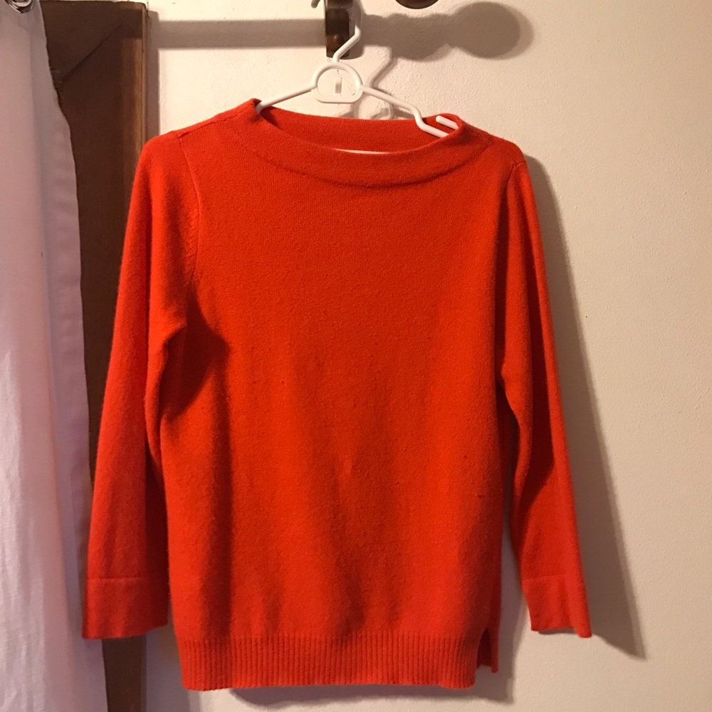 Super soft orange cashmere sweater.