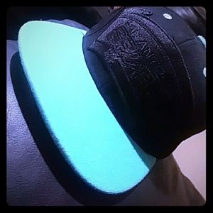 Black and Turquoise Mitchell & Ness spurs hat