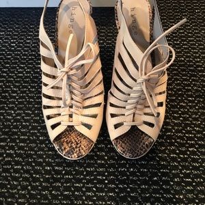 Wedges with faux snake skin lining and wood heel