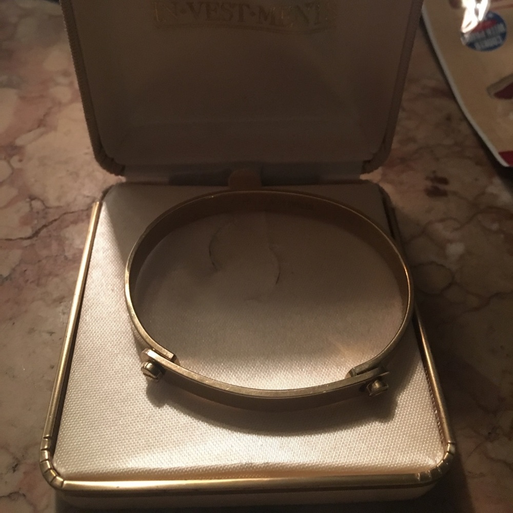 Designer Aldo Cipullo's gold plated love bracelet