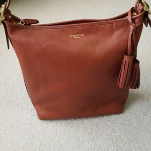NWOT Coach legacy leather duffle in Cognac