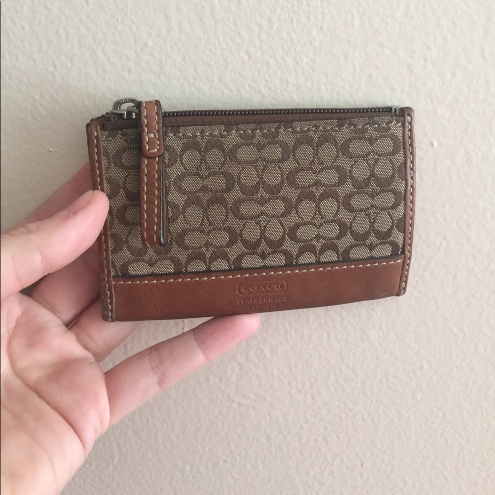 Small card sized wallet. Coach brown with "c"