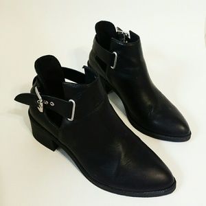 Black booties with silver buckle