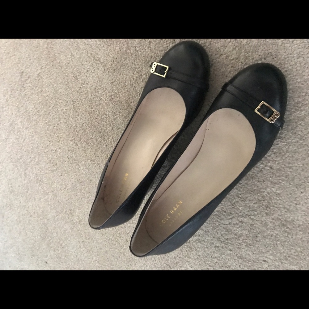 Black Cole Haan Wedges size 8 with gold buckle.