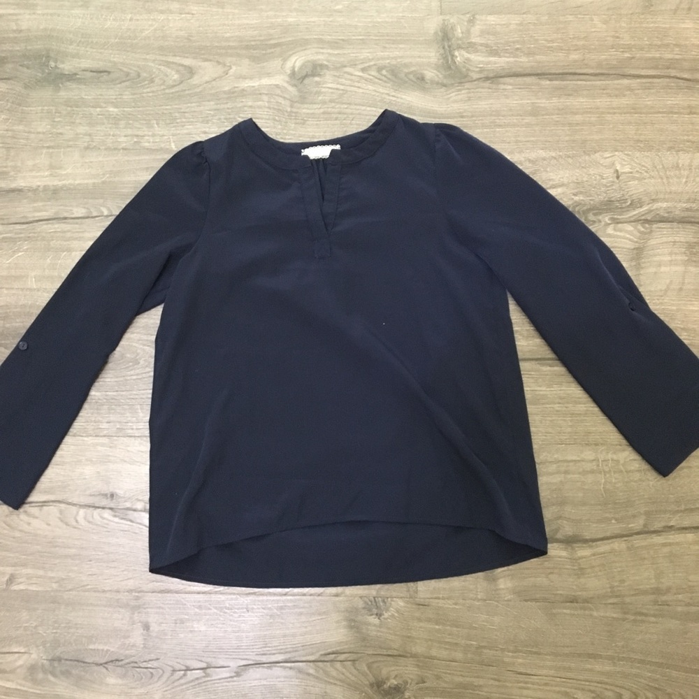 Navy blouse with button tabs to shortten sleeves