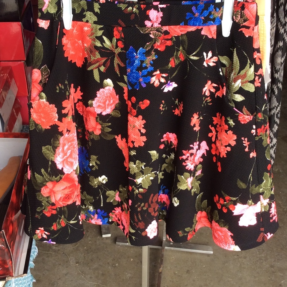 Black skater skirt with floral pattern.