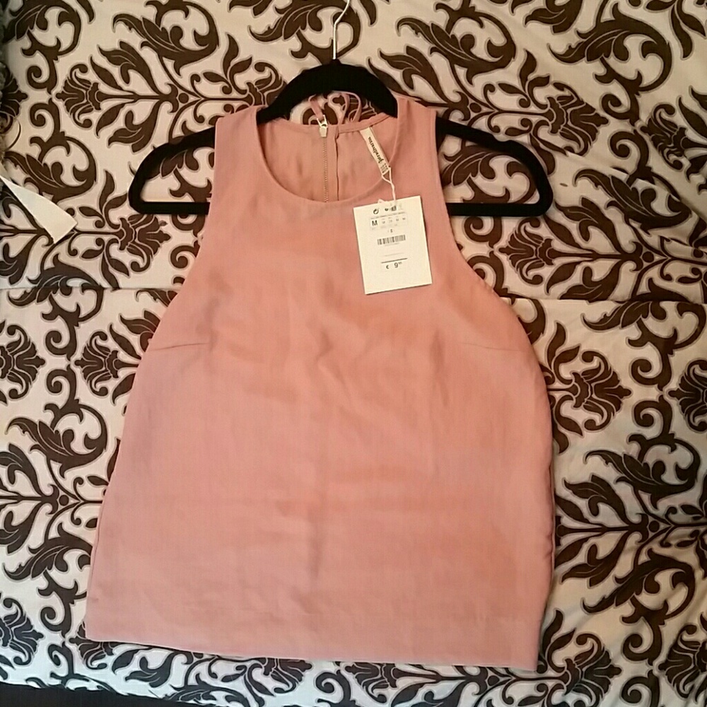 Pink sleeveless blouse