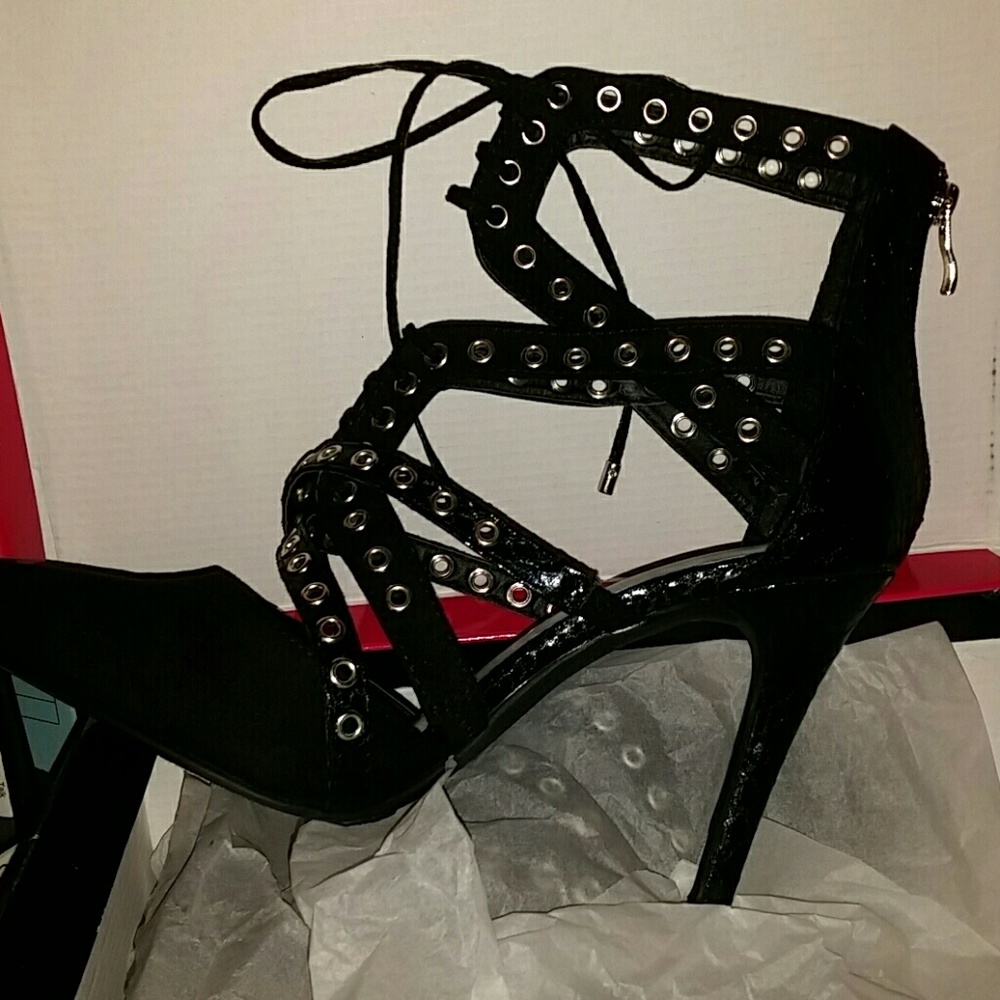 Black strapped high heels shoes